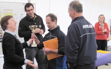 Captain Cathro accepts the trophy with interpreter Roy Crichton