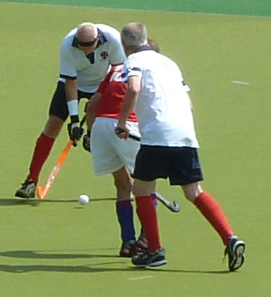 Alan Bain tackles an LX65 attacker with Doug Turner in close attendance